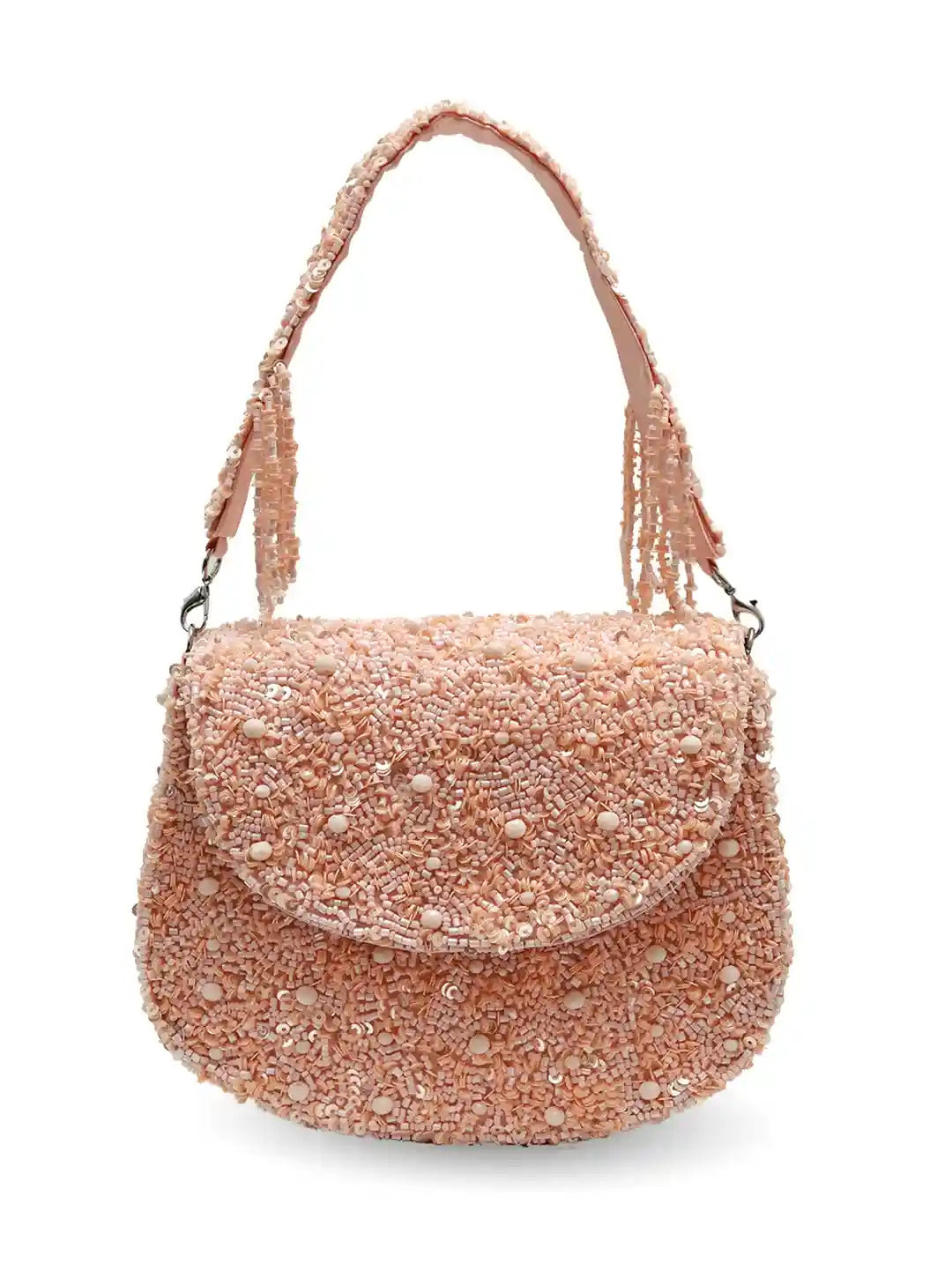 Pink beaded handbag on a white background