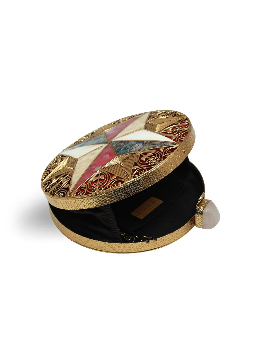 Decorative jewelry box with gold lid and multicolored stone inlay on a white background