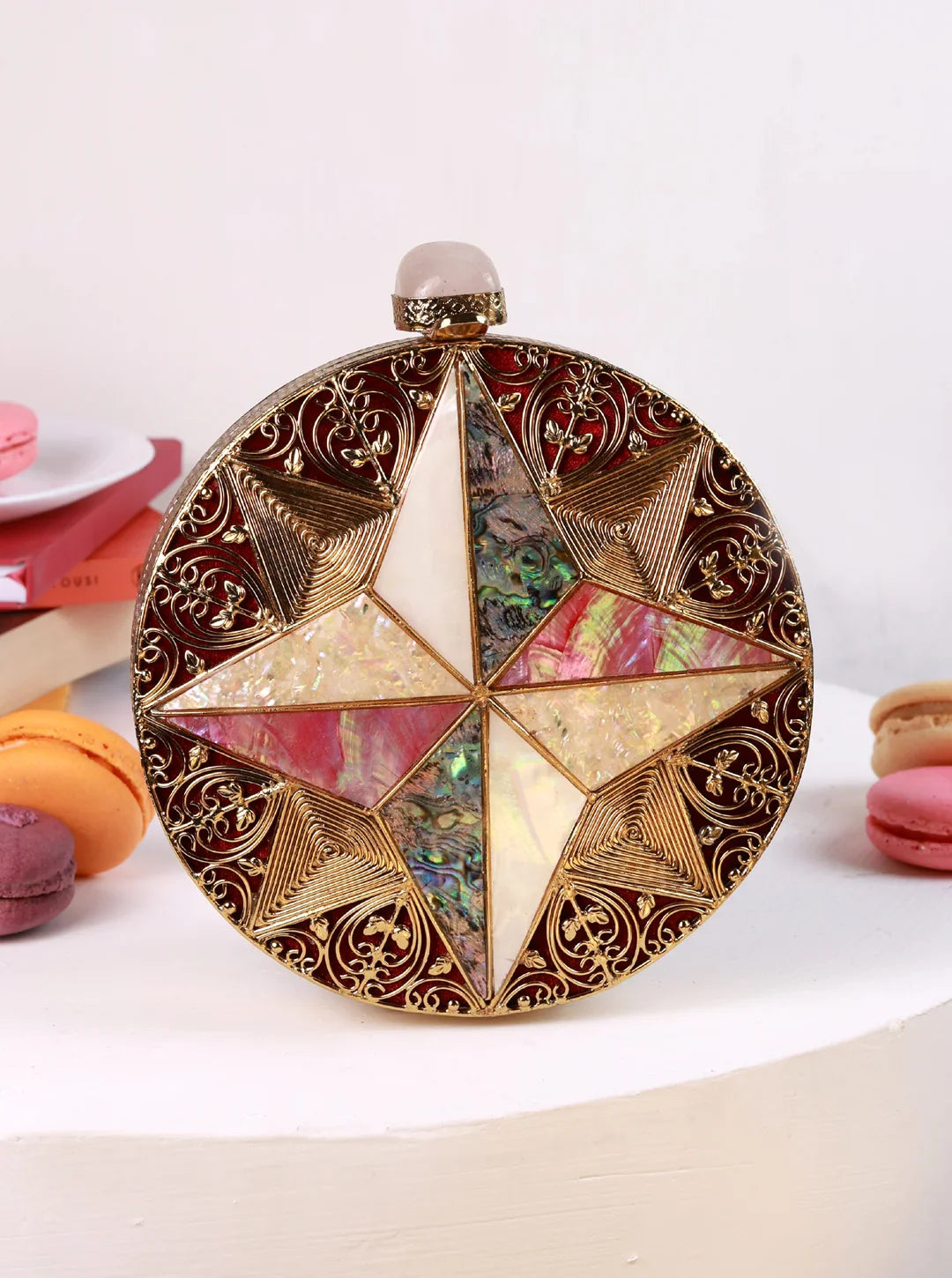 Decorative round object with star design on a white background