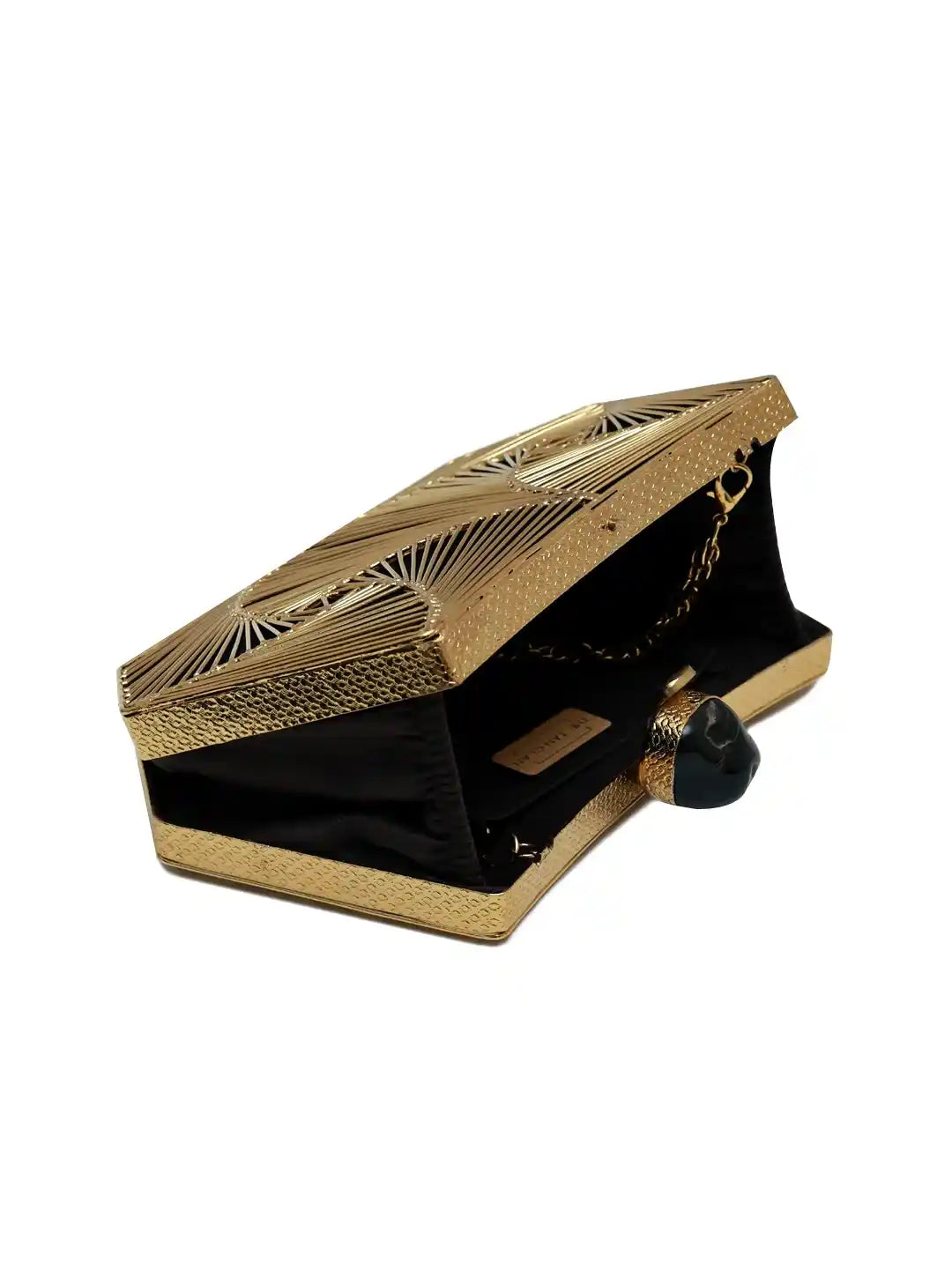 Gold and black clutch with decorative patterns on a white background
