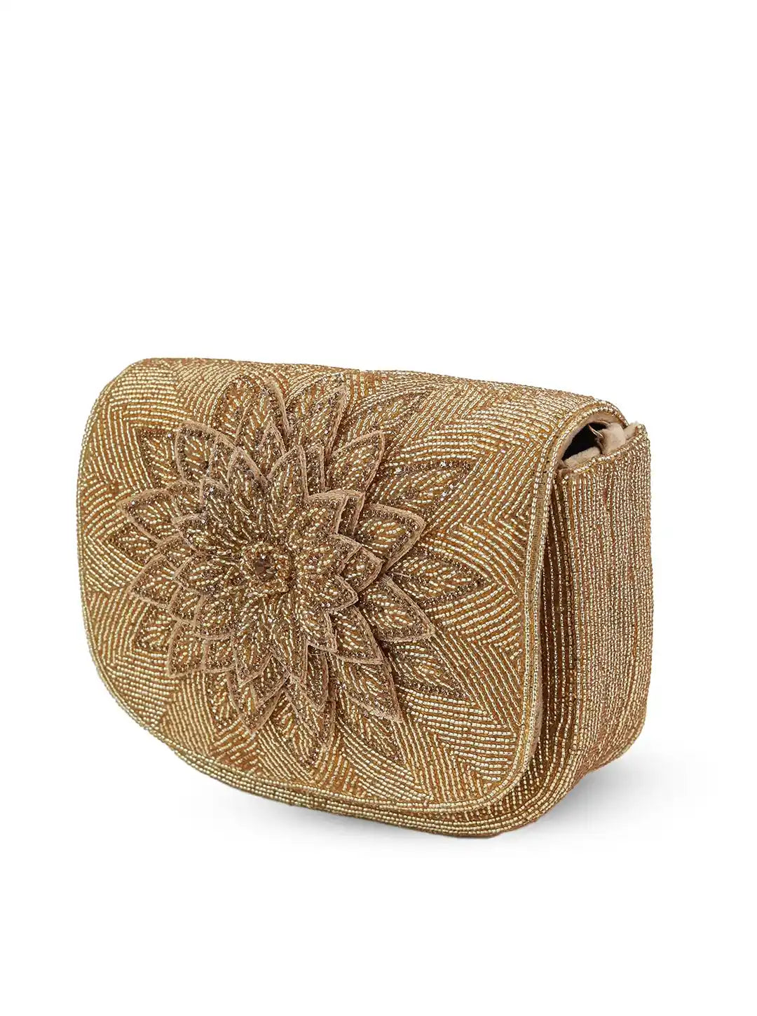 Gold clutch bag with intricate floral design on a white background