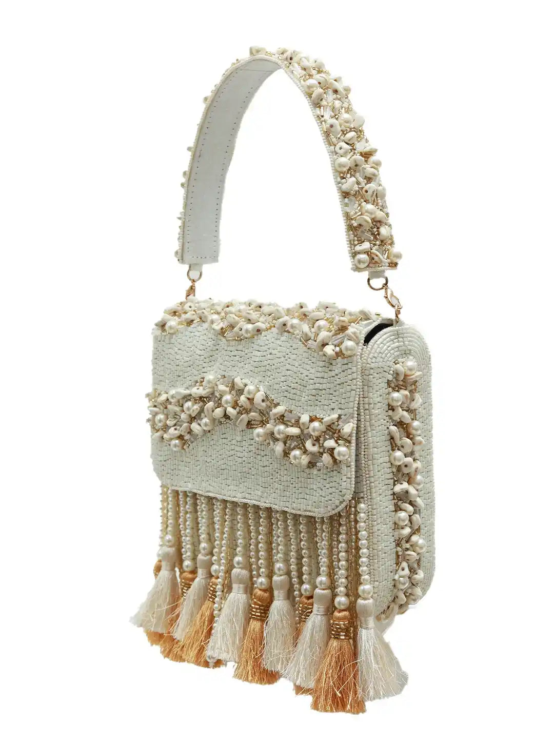 Light blue handbag with pearl embellishments and tassels on a white background