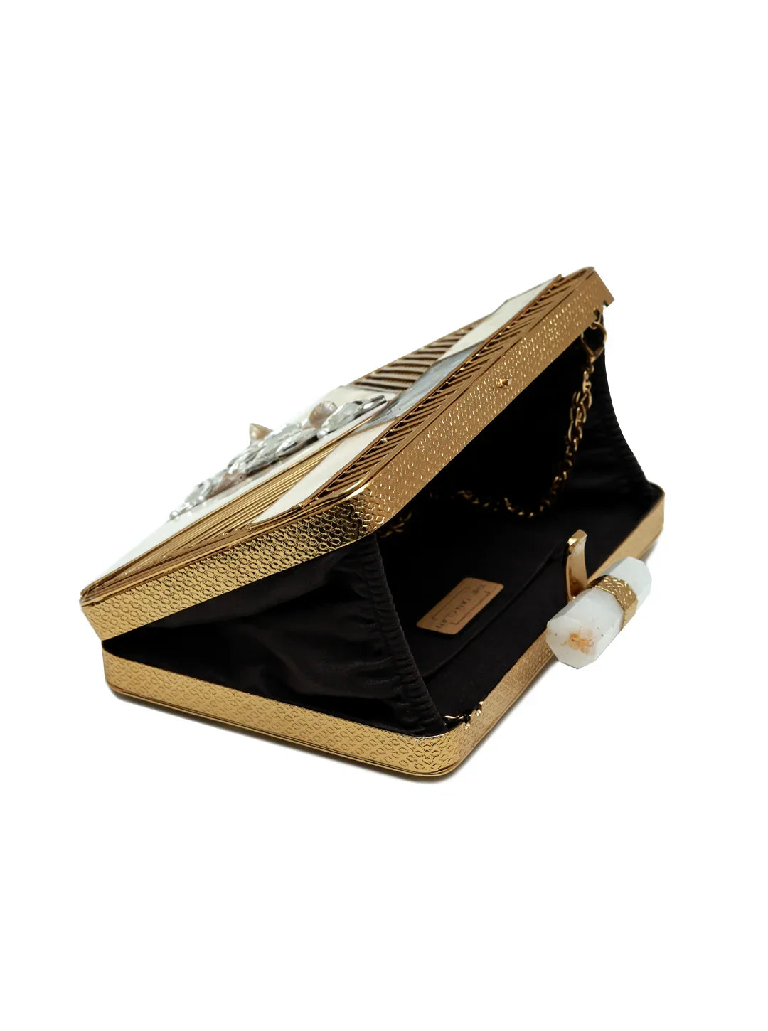 Gold clutch bag with intricate design on a white background