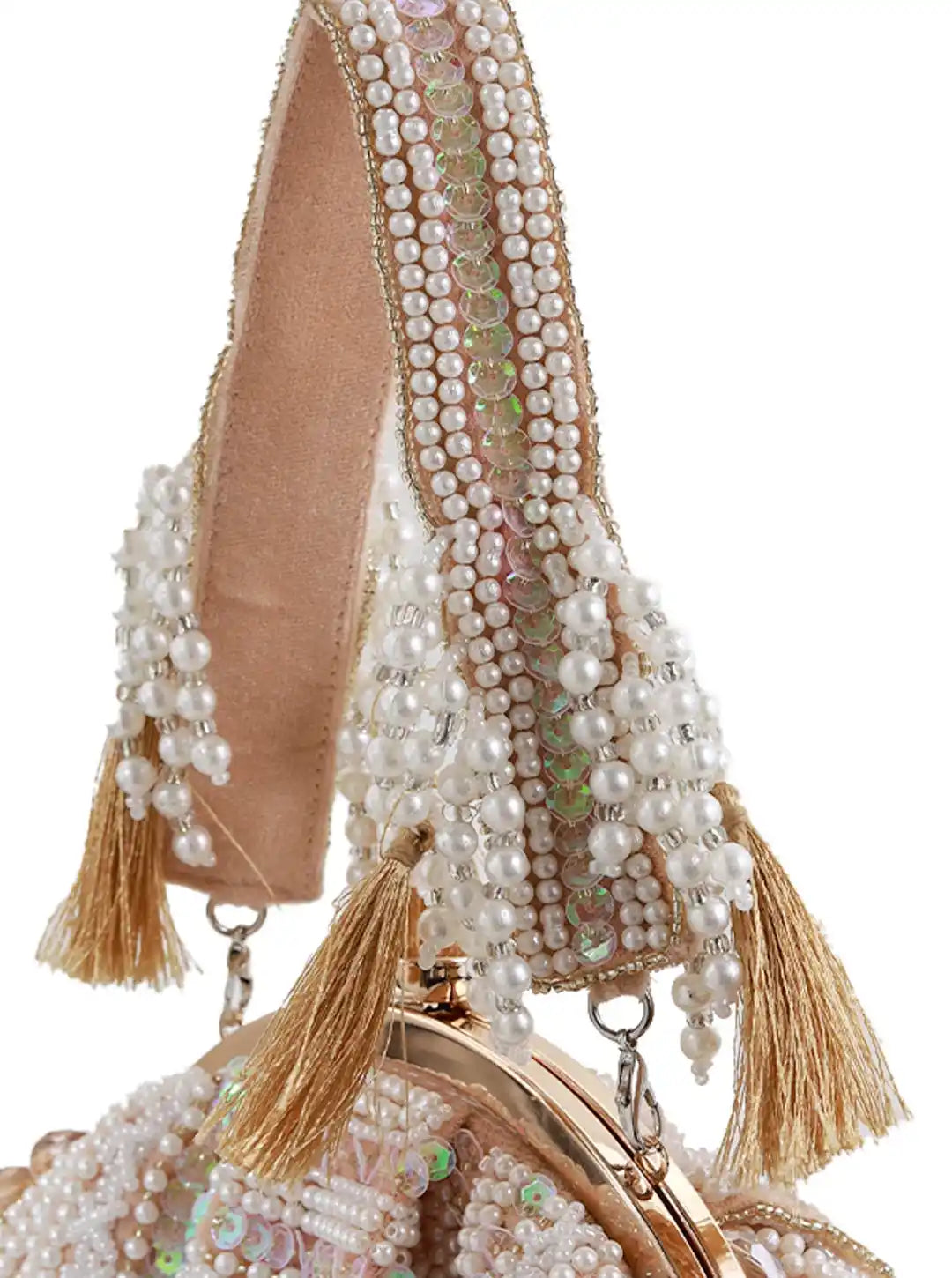 Decorative handbag with pearls and tassels on a white background