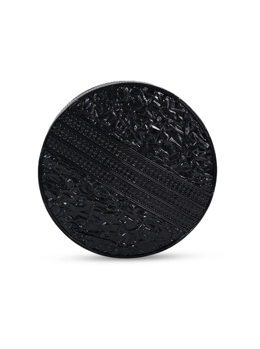 Black textured round object on a white background