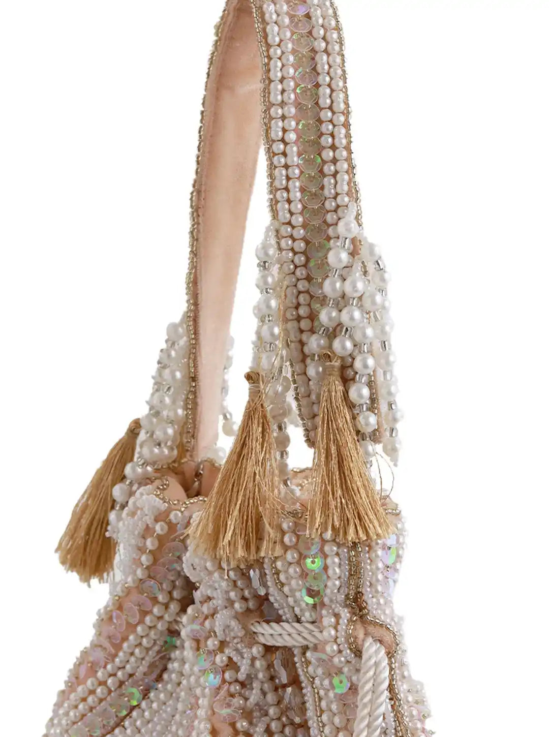 Decorative handbag with beads and tassels on a white background