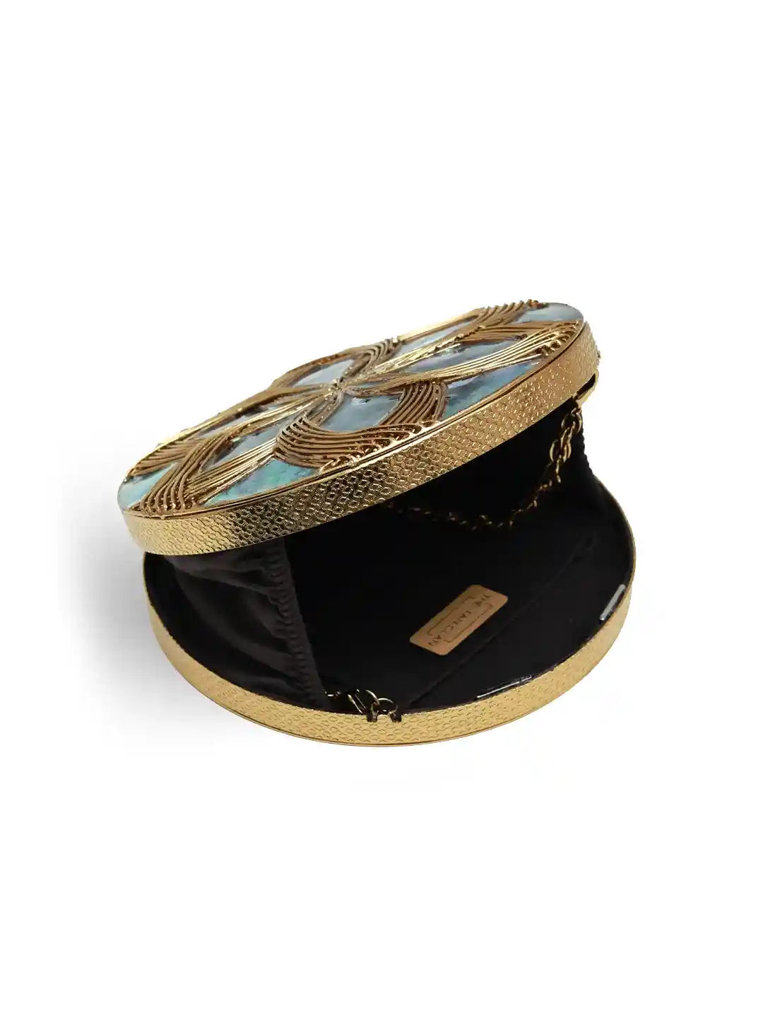 Round decorative box with gold and black design on a white background