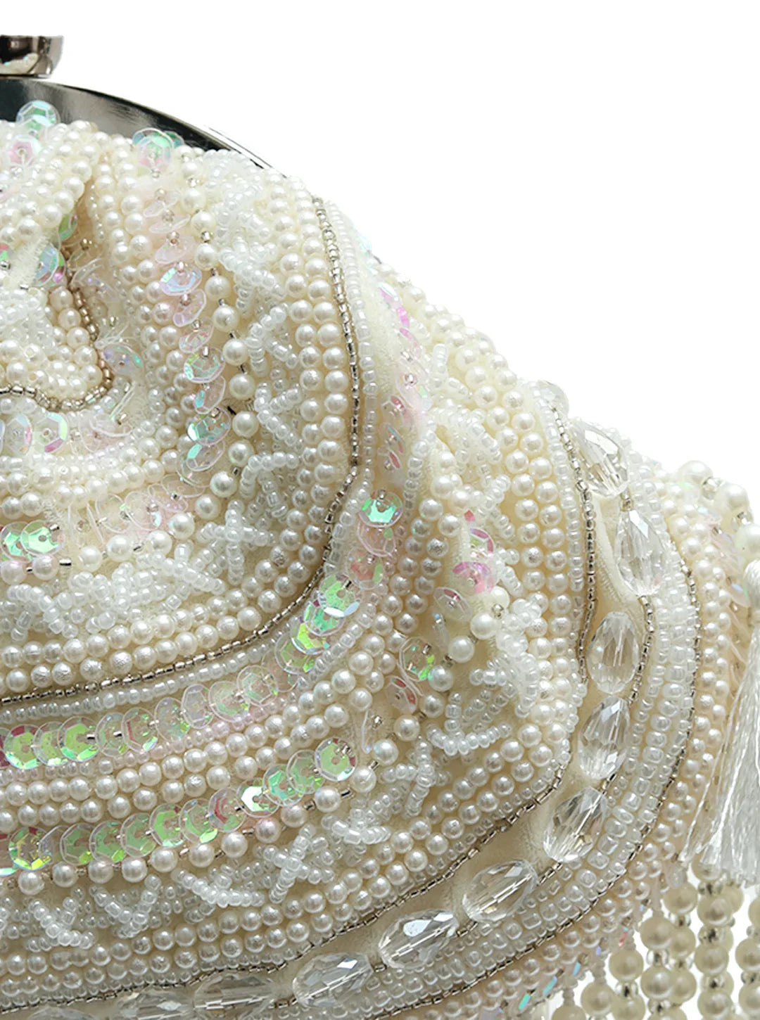 Close-up of a pearl and crystal handbag on a white background