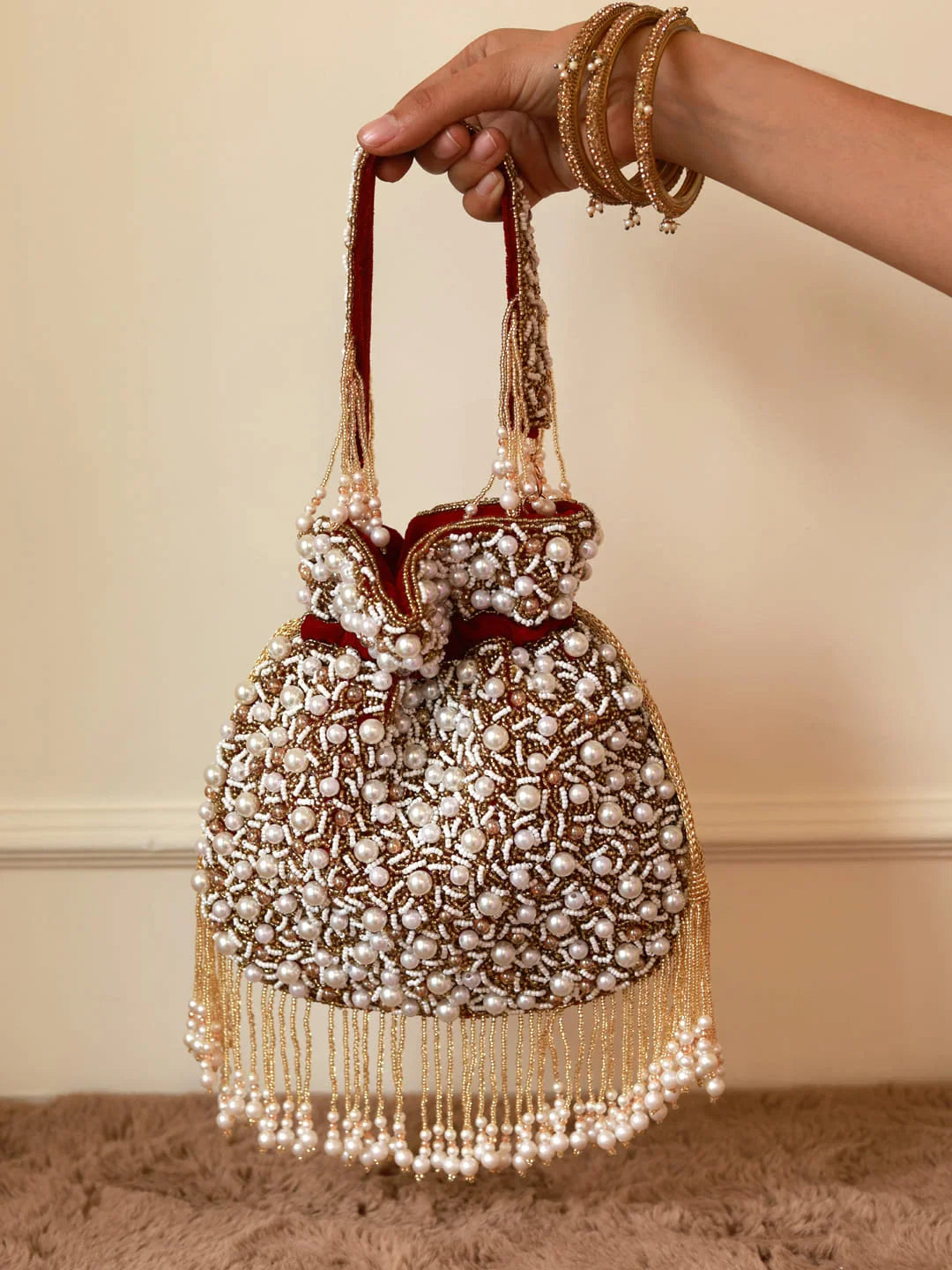 Rimsha Red Pearl Potli Bag with Tassels