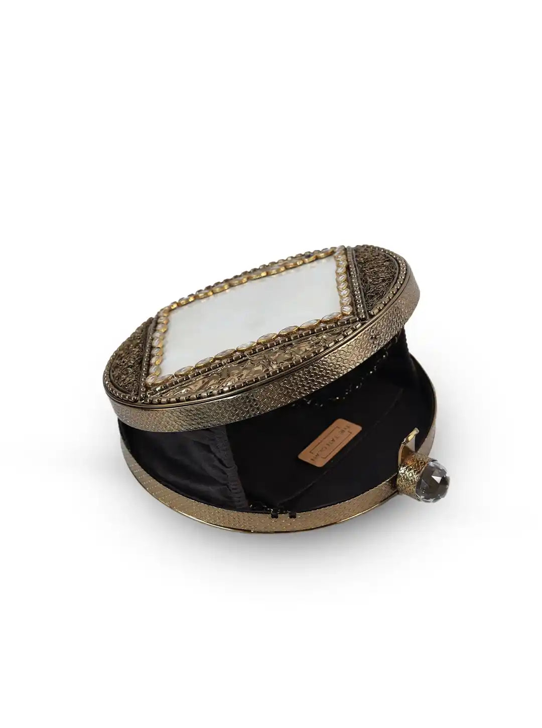 Decorative box with intricate gold design on a white background