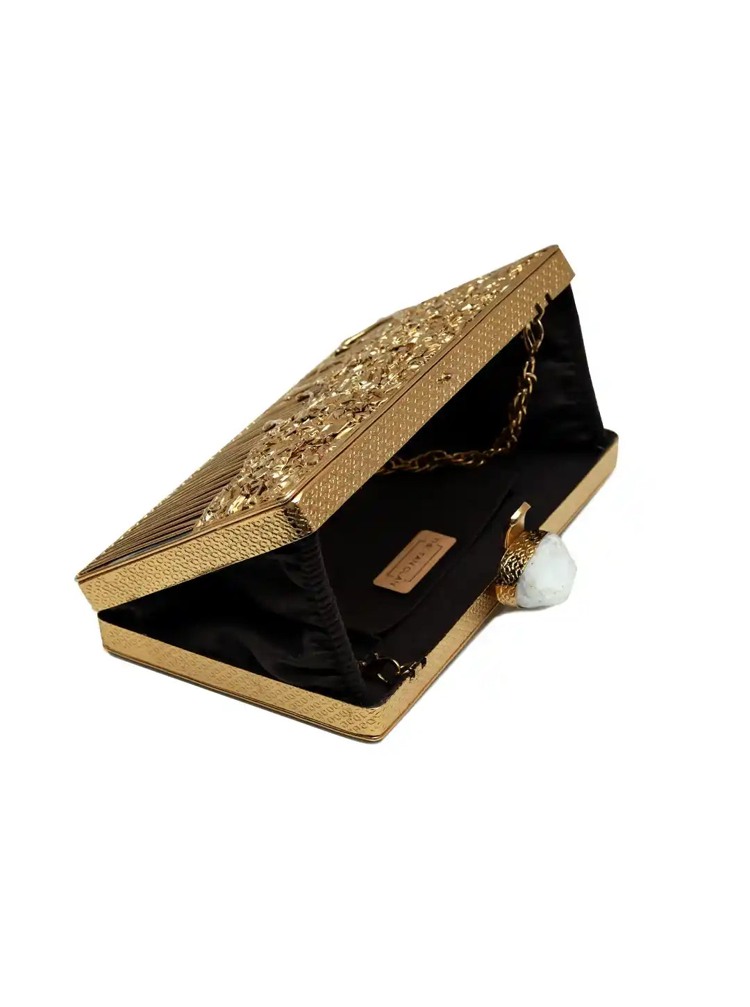 Gold clutch with intricate designs on a white background