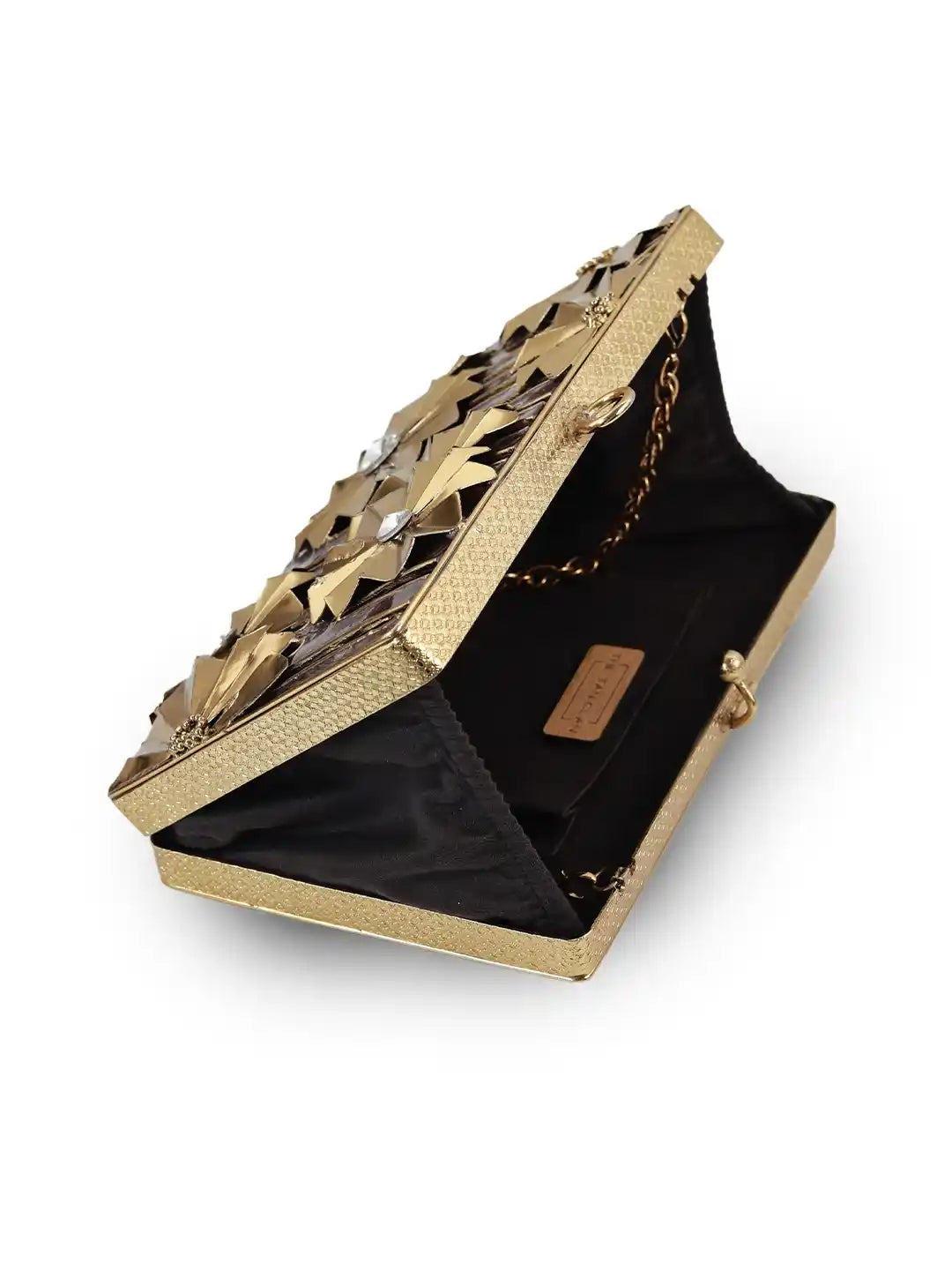 Gold clutch with intricate design on a white background