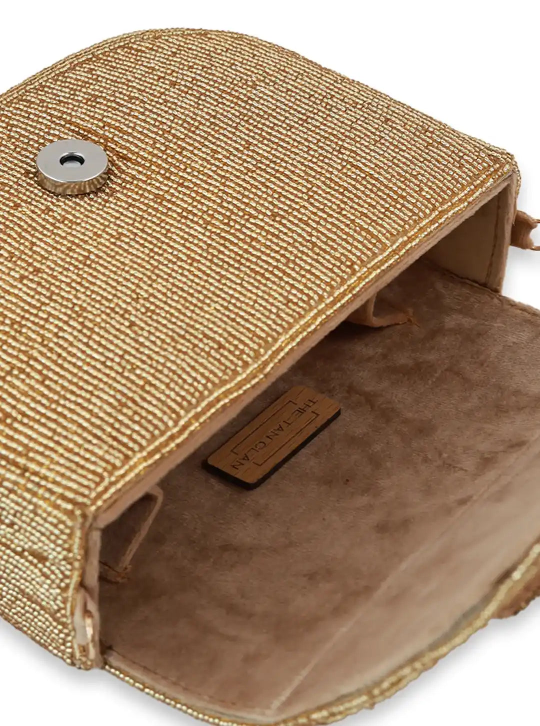 Close-up of a textured beige pouch with a metal clasp on a white background
