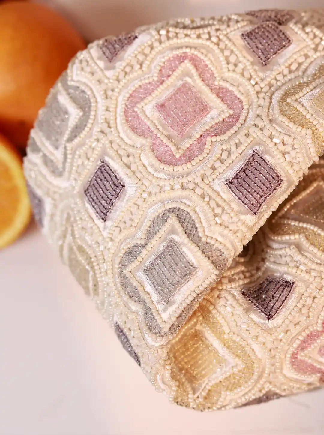 Decorative bag with geometric pattern on a white surface