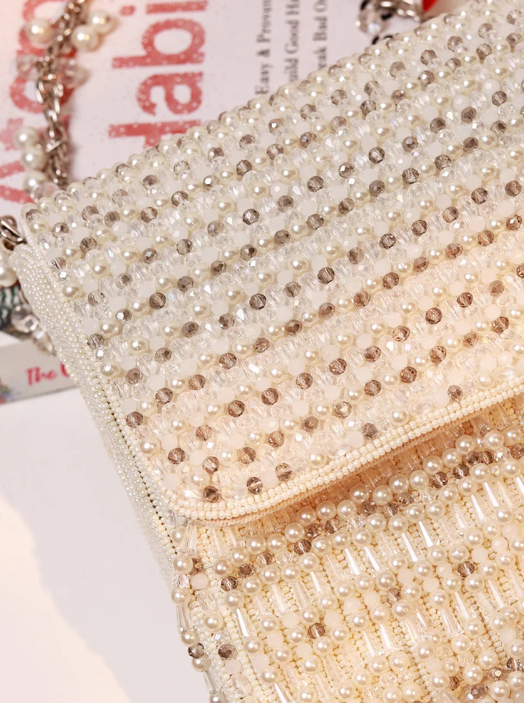 Close-up of a beaded clutch bag with a blurred background