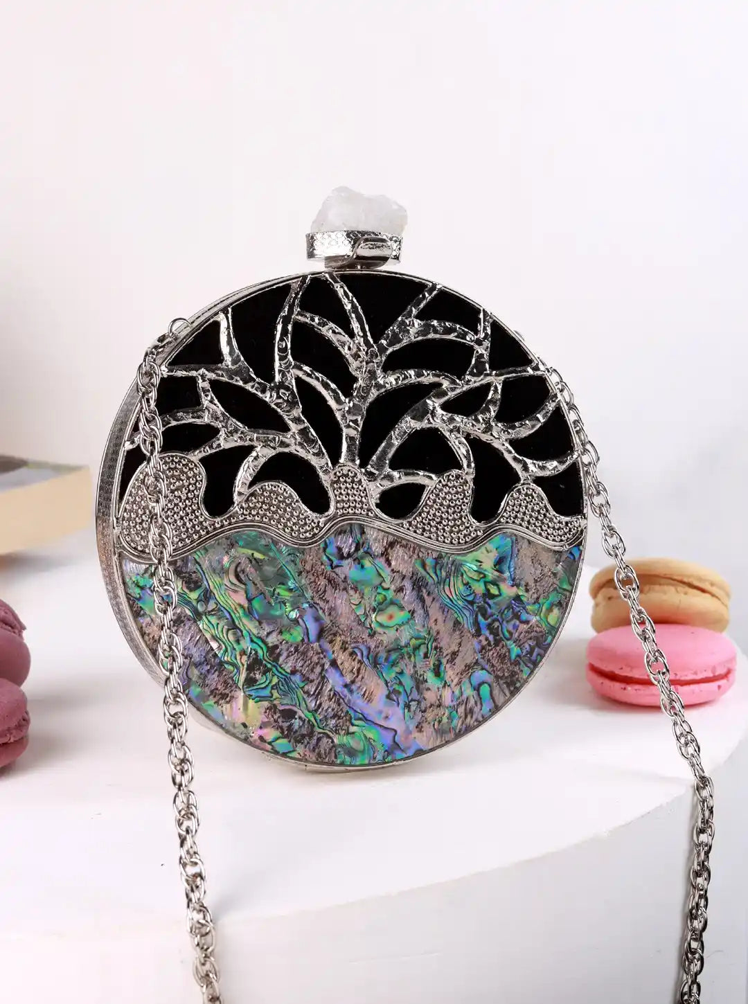 Decorative handbag with intricate design on a white background