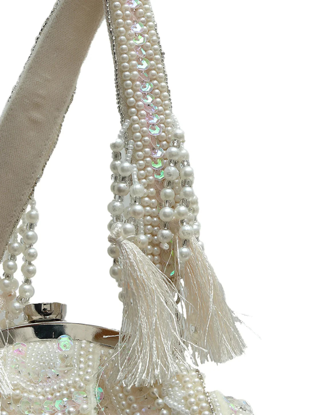 Pearl-handled clutch with tassels on a white background