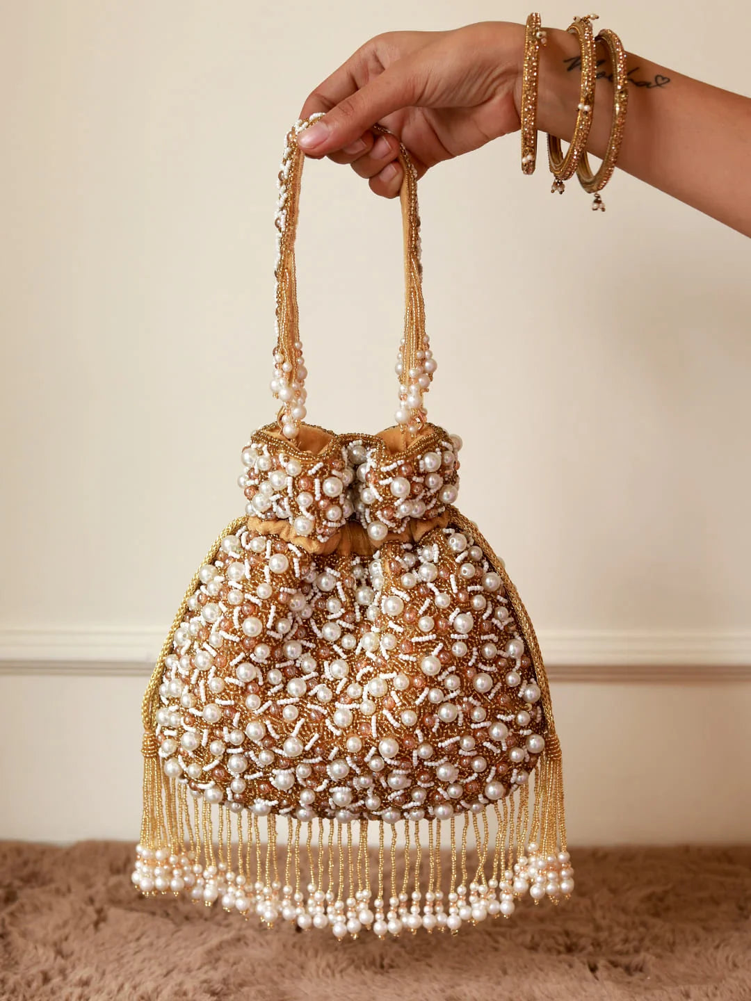 Rimsha Golden Pearl Potli Bag with Tassels