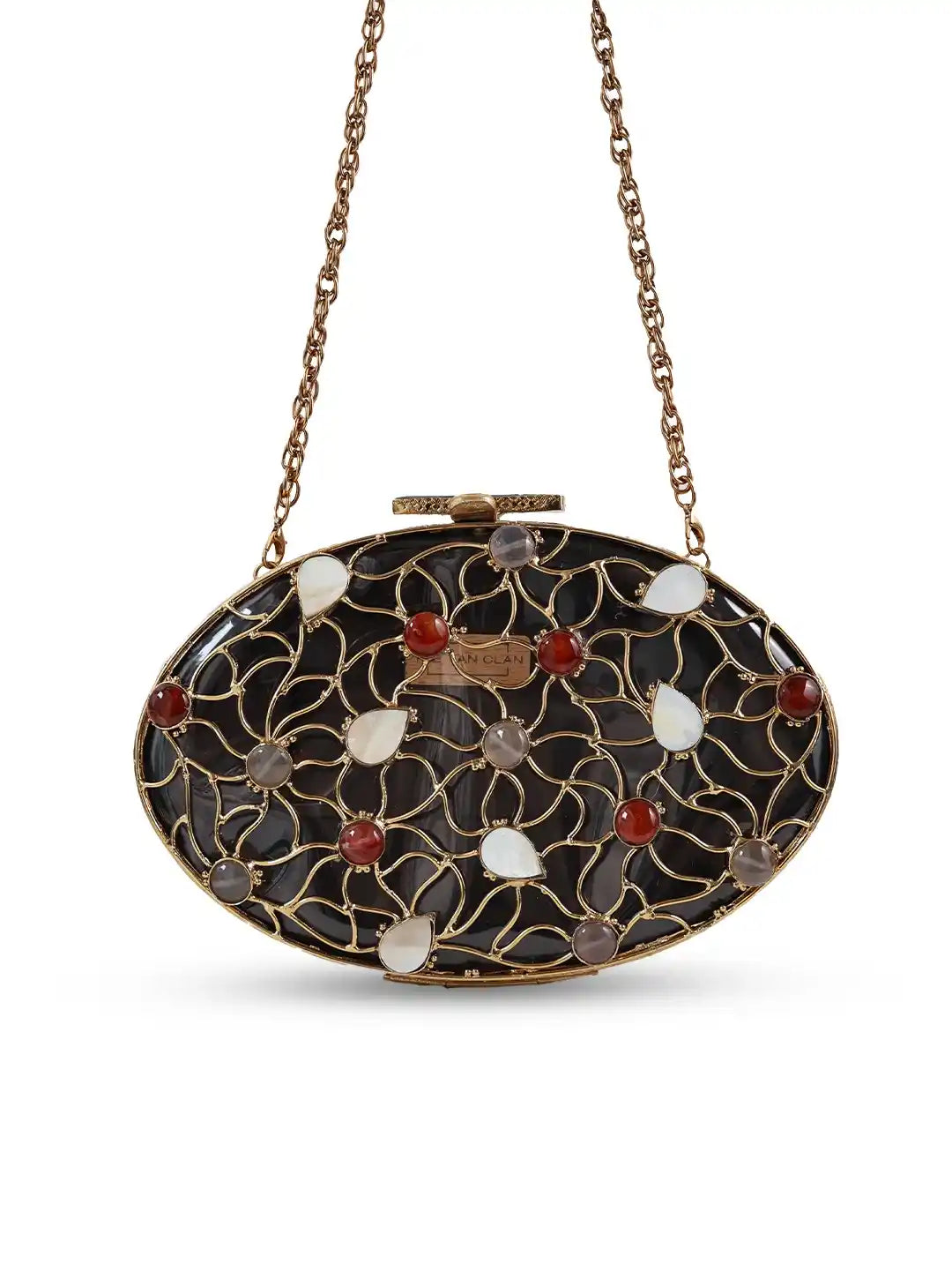 Decorative clutch bag with intricate design and chain strap on a white background