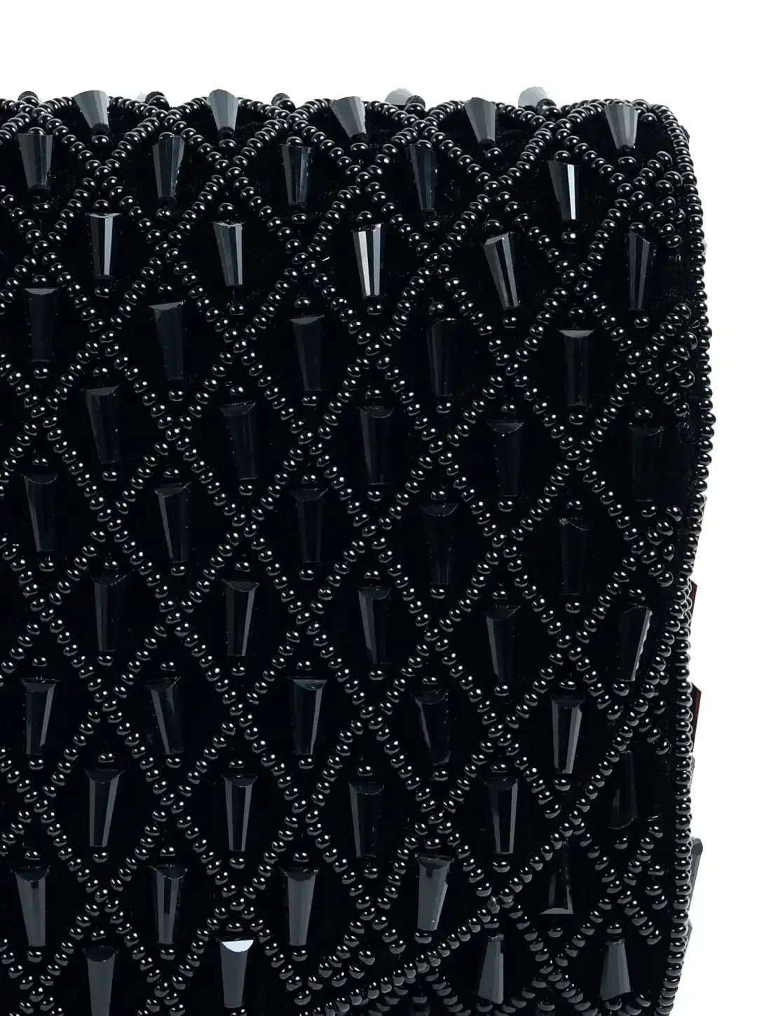 Close-up of a black beaded clutch bag with a diamond pattern.