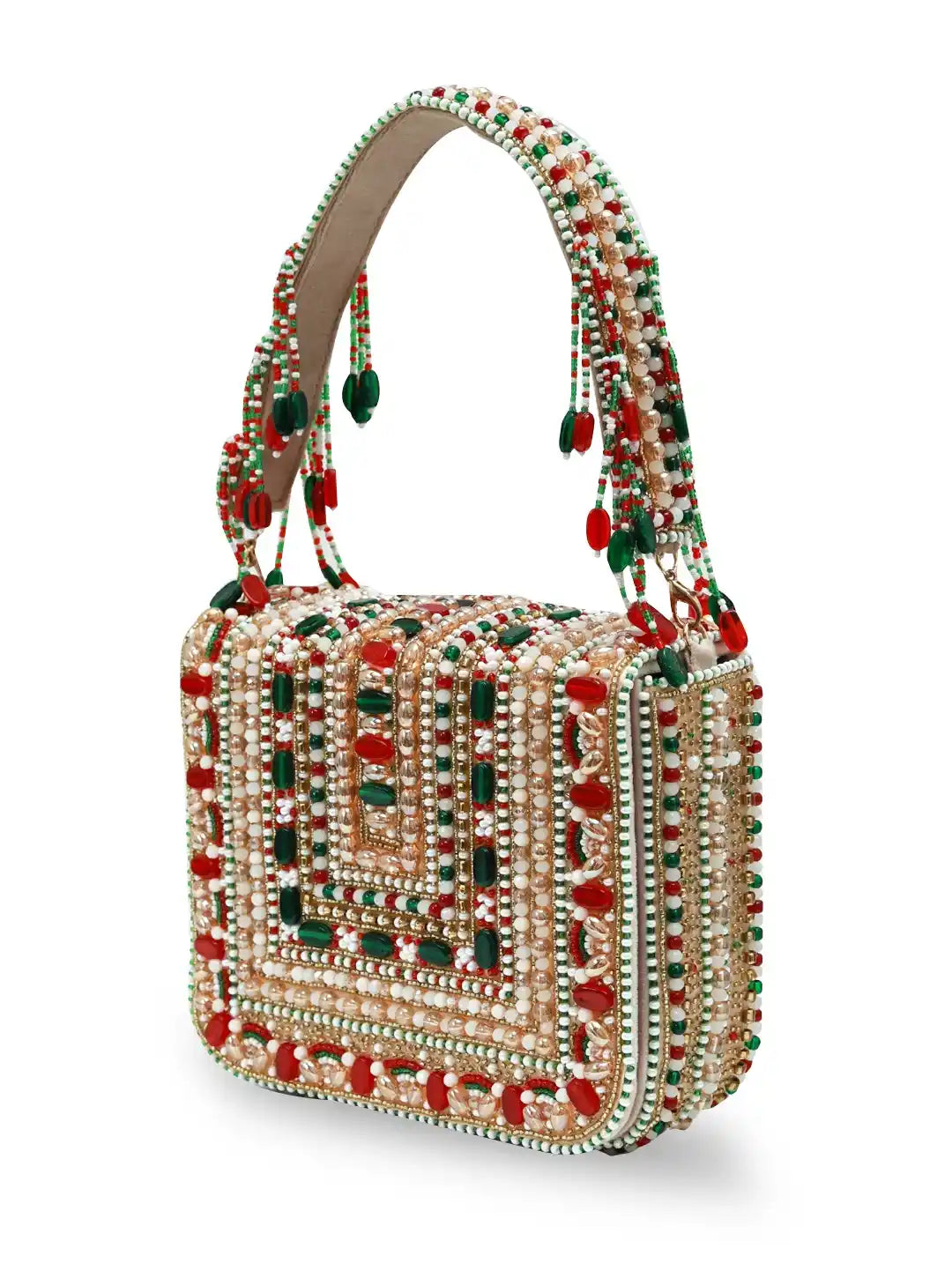 Decorative handbag with red and green embellishments on a white background