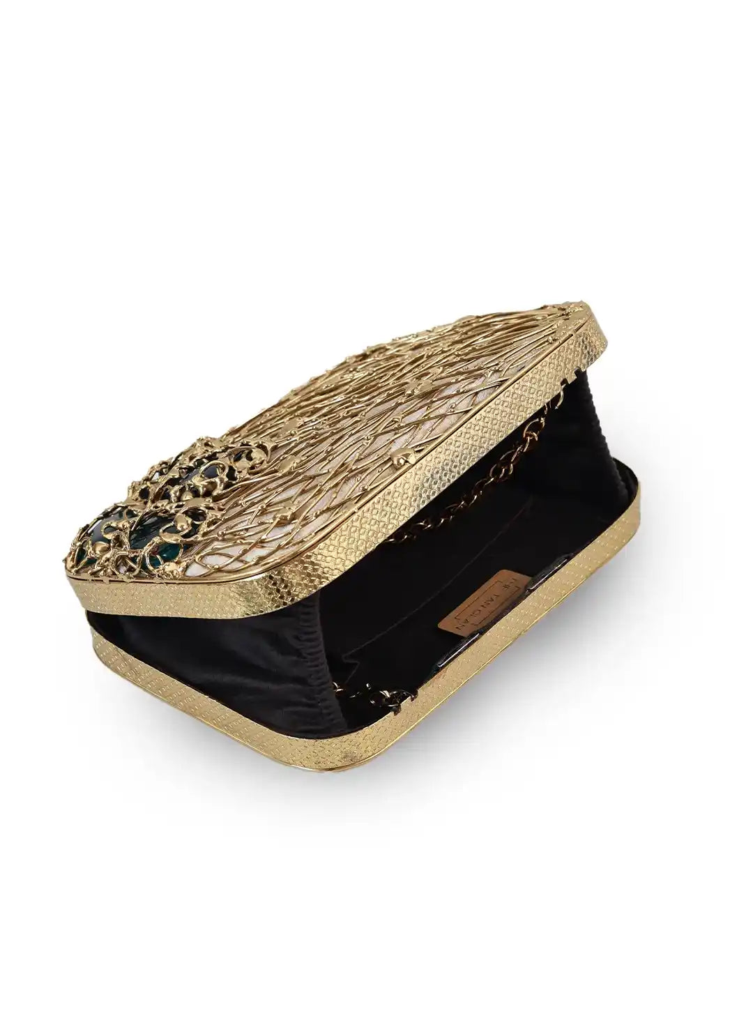 Gold clutch with intricate design on a white background